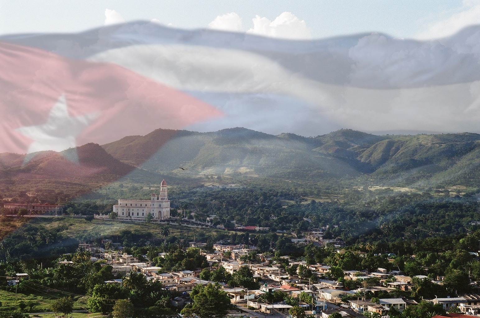 Cuban flag over a mountain landscape in Cuba